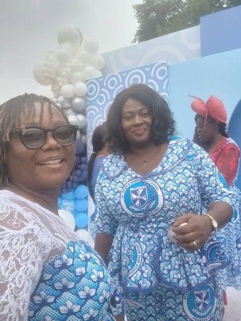 Two friends by the blue balloons