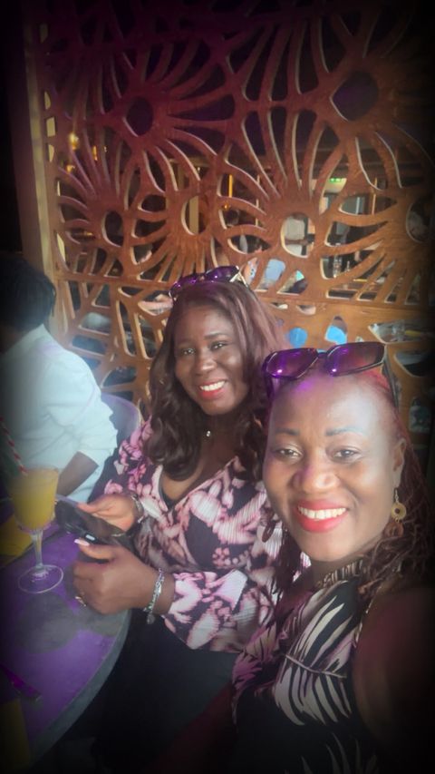 Two friends at an evening event