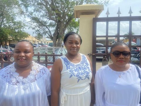 Three friends in white and blue