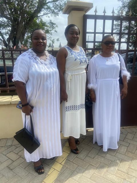 White outfits outside the venue